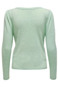 Chaqueta de punto premamá color verde claro.