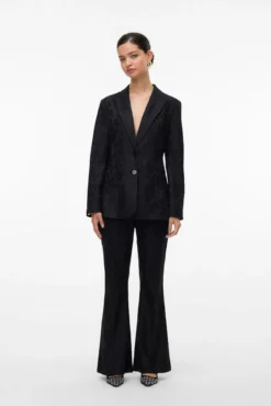 Pantalón acampanado efecto encaje