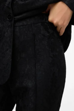 Pantalón acampanado efecto encaje