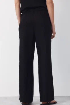 Pantalón con lino con botones dorados