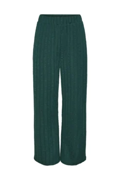 Pantalón de pata ancha y fluido.Cintura elástica.