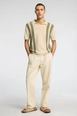 Polo de punto con cuello abierto