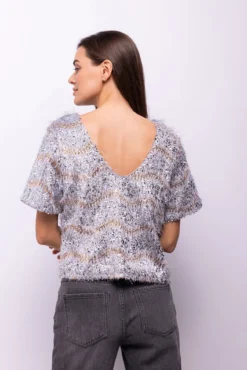 Top lentejuelas y flecos